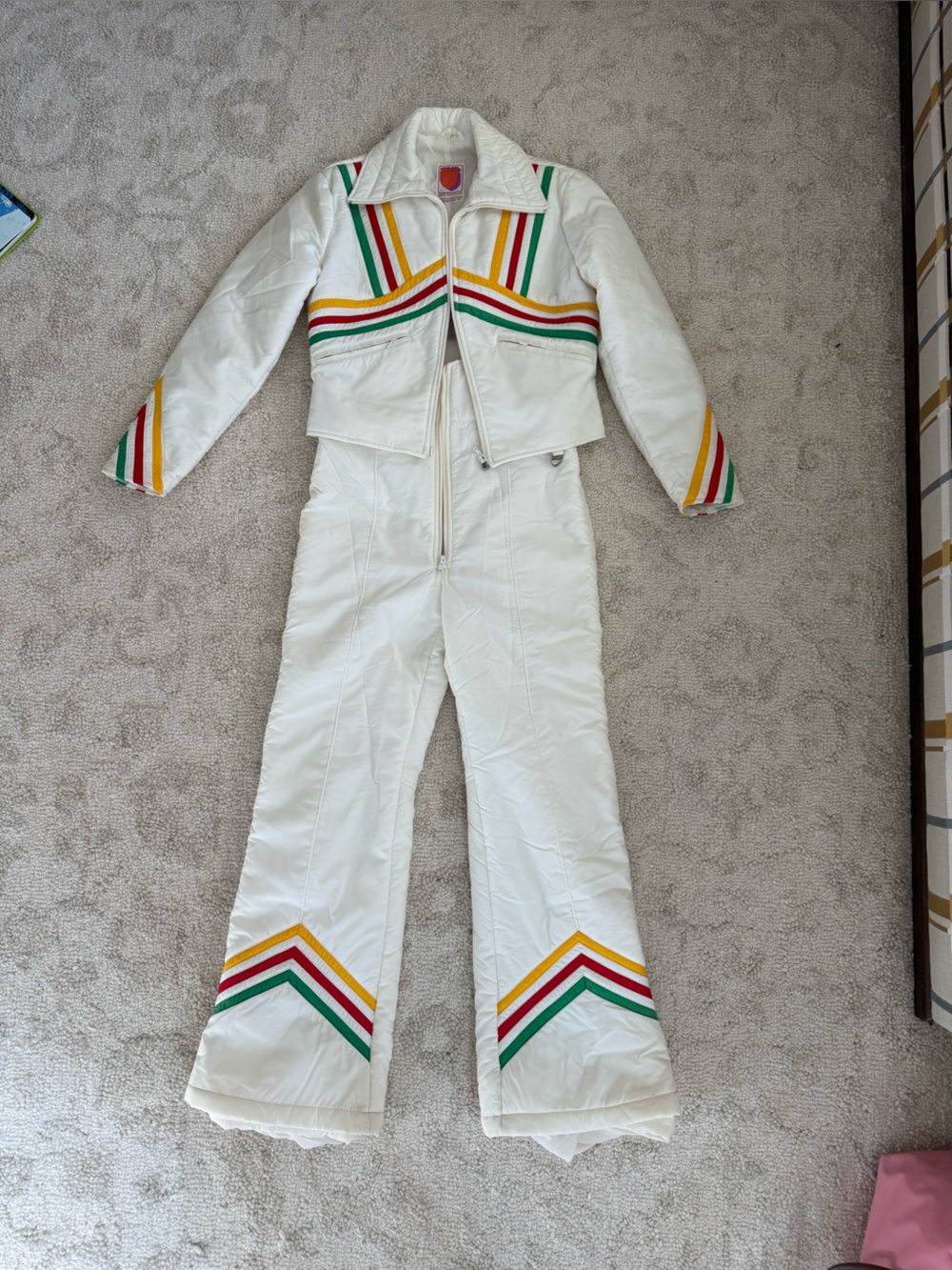 Skyr Scandia Vintage White Women's Ski Jumpsuit with Rainbow Accents